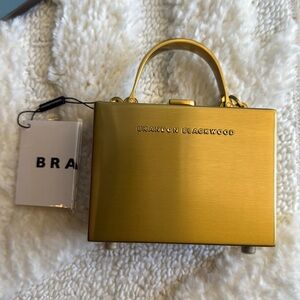 Brandon Blackwood gold mini trunk